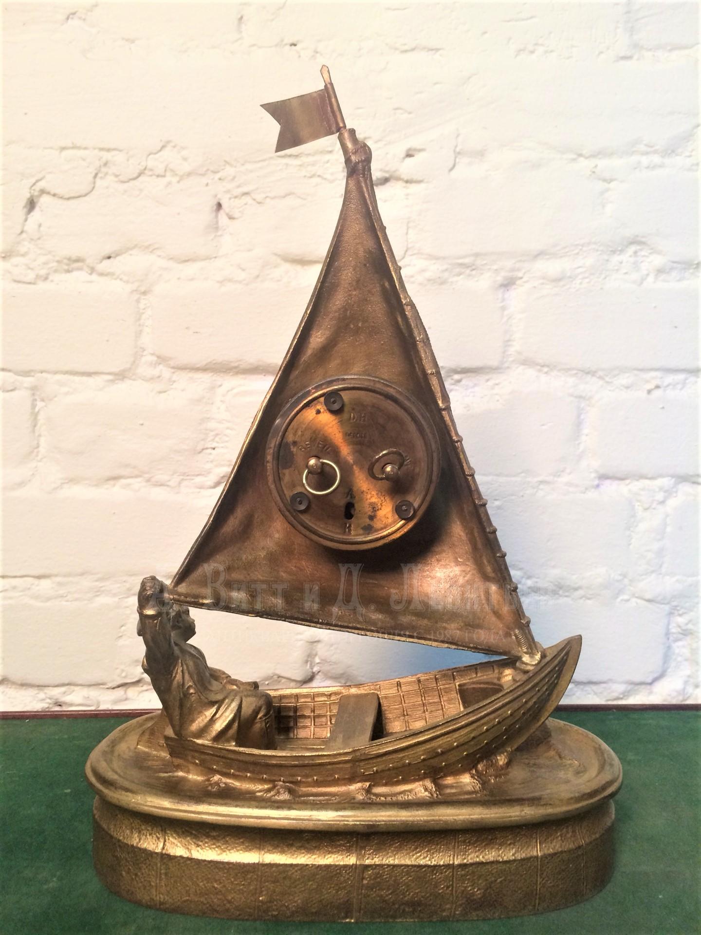 Настольные антикварные часы Мальчик в лодке с будильником золоченые